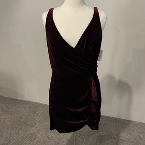 Deep wine color, velvet, form fitted dress.
